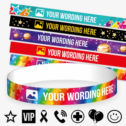 Customisable wristbands in various colourful designs, each displays the placeholder text 'YOUR WORDING HERE' alongside an icon. Background themes include stars, galaxies, and rainbows. At the base of the image, there are additional black icons such as a star, VIP badge, ribbon, phone, medical cross, balloons, and a smiley face, suggesting design options for personalisation. 