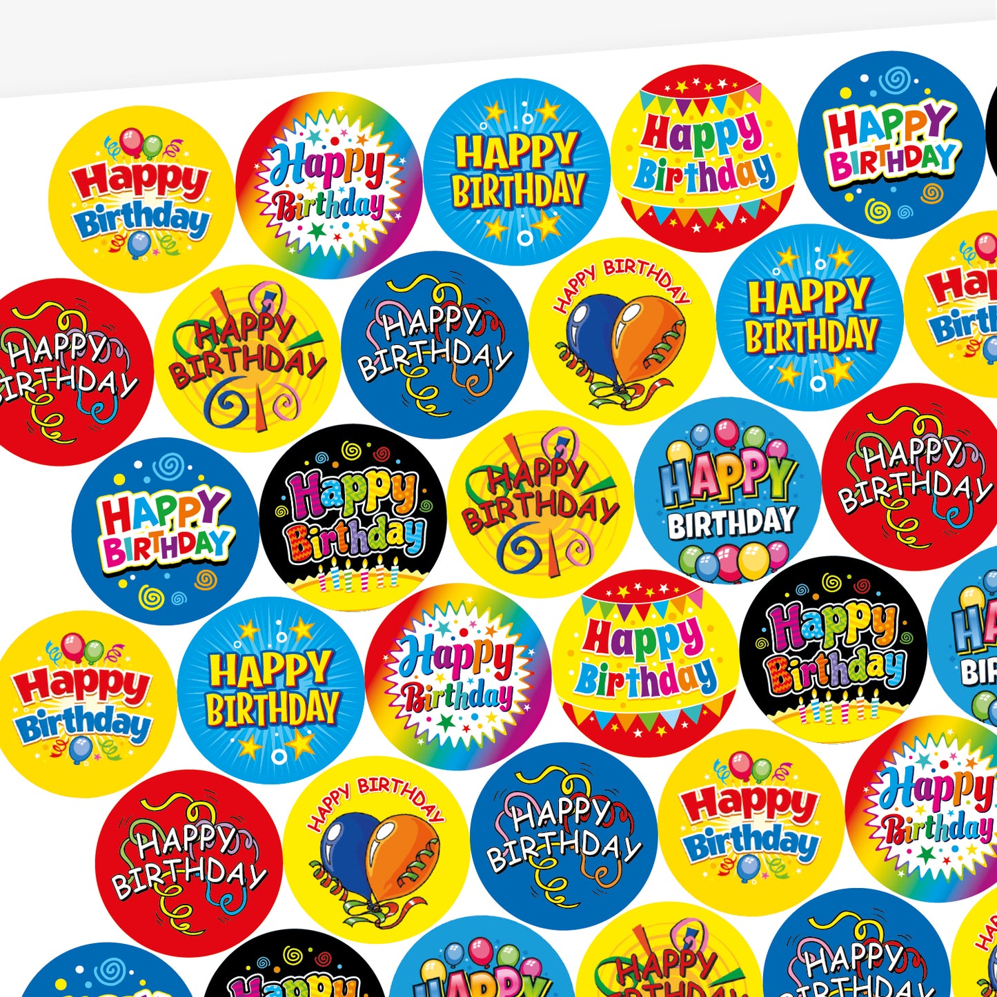 Sheet of strawberry scented round birthday stickers in various bright colours and designs. Each sticker features the phrase 'Happy Birthday' in different playful fonts, with decorative elements such as balloons, stars, swirls, and confetti. Backgrounds include red, yellow, rainbow, blue, and black themes.
