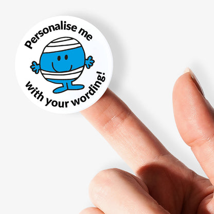 Circular sticker with a blue character and text 'Personalise me with your wording!' held between fingers.