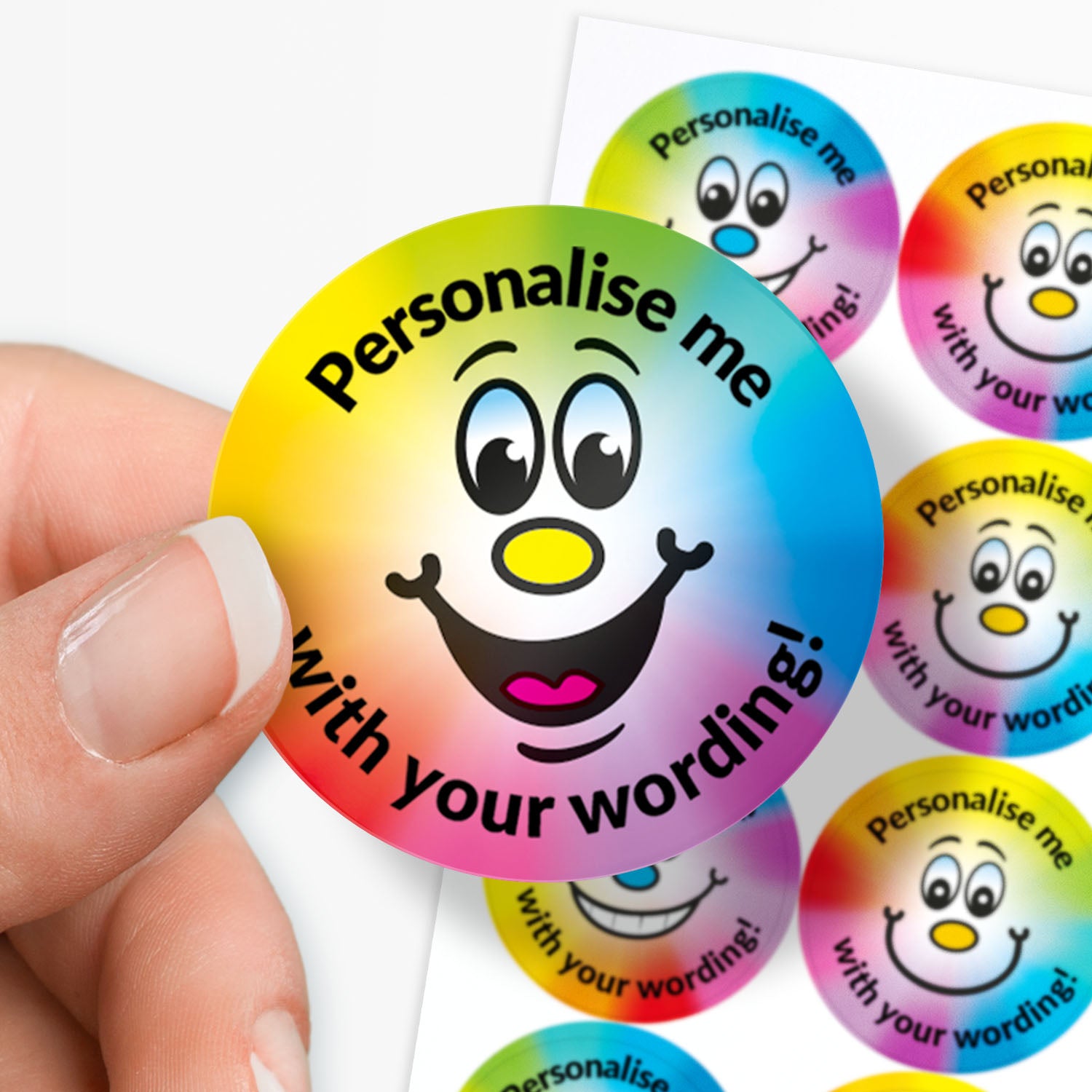 Colorful round stickers with smiling faces and text 'Personalise me with your wording!' held by a hand.