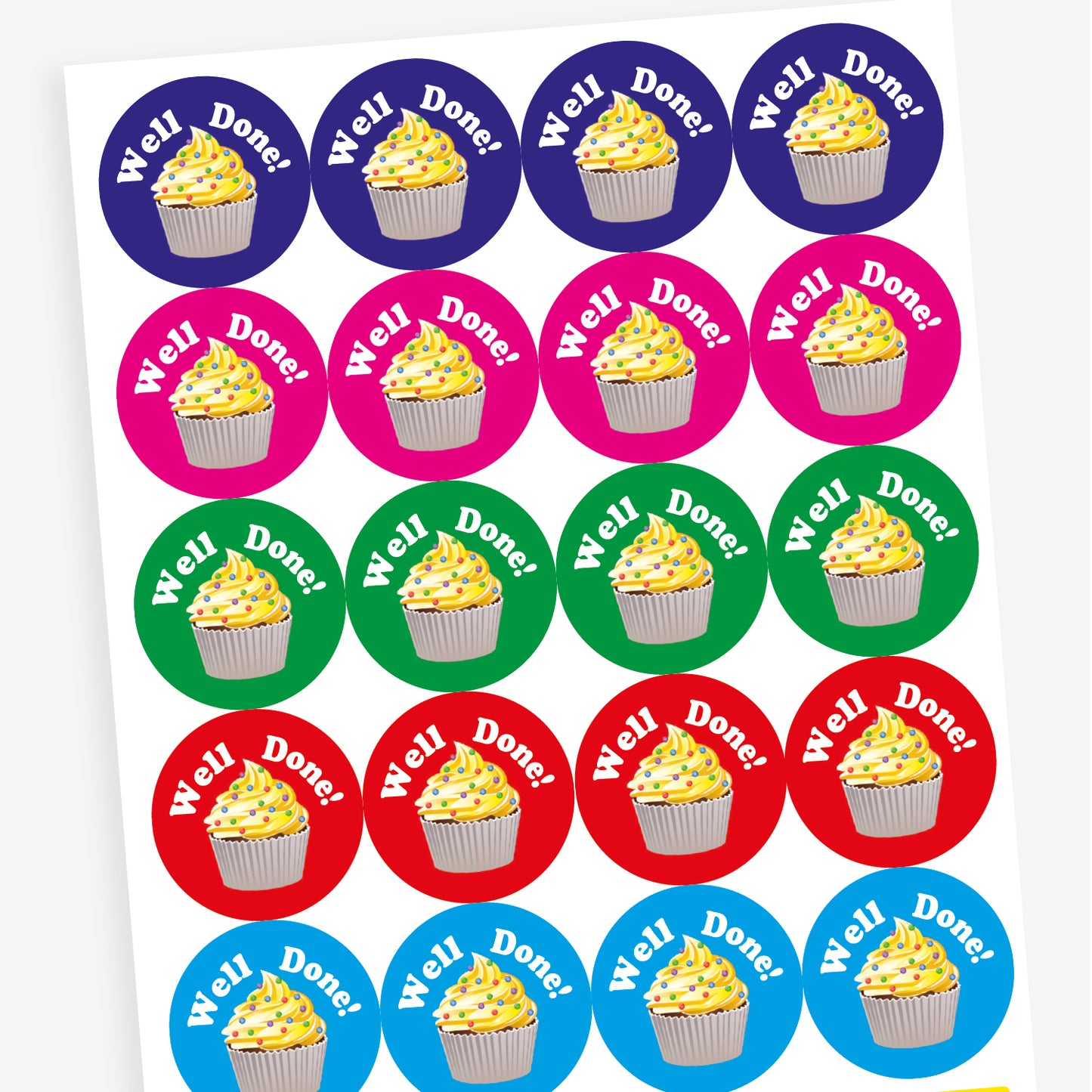 Overview of sheet of circular, vanilla scented stickers, each with a cupcake with vanilla frosting as the main image below the phrase 'Well Done!'.  Colourful backgrounds of blue, magenta, cyan, red and green are shown.