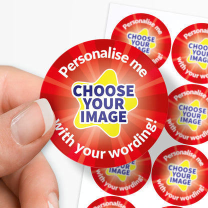 Round customisable sticker with text 'Personalise me, choose your image with your wording!' held by a hand with sticker sheet in the background.