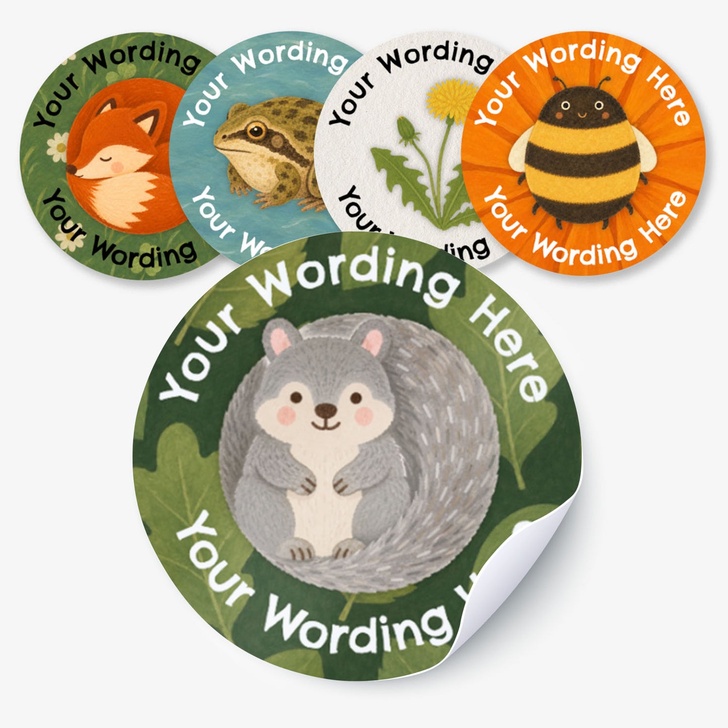 Five nature themed custom sticker designs, each with a different animal/plant illustration and the text 'Your Wording Here.' The stickers include a fox, frog, dandelion, bumblebee and grey squirrel, with white text and colourful nature-themed backgrounds.