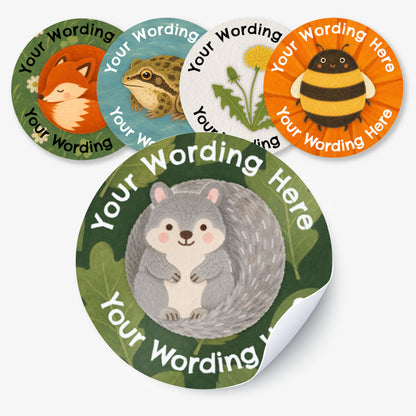Five nature themed custom sticker designs, each with a different animal/plant illustration and the text 'Your Wording Here.' The stickers include a fox, frog, dandelion, bumblebee and grey squirrel, with white text and colourful nature-themed backgrounds.