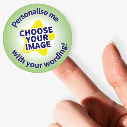 Colorful sticker with text 'Personalise me, choose your image with your wording!' held by hand on a white background.