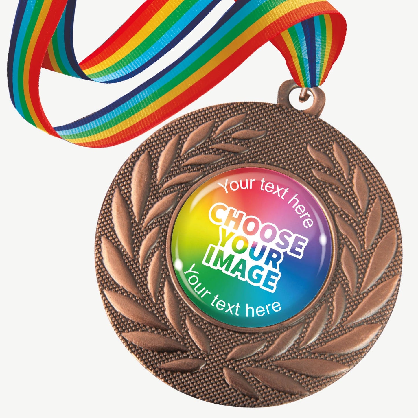 A set of ten bronze-coloured metal medals, each featuring a central 25mm circular area for custom designs, encased in a clear, glossy dome; surrounded by a laurel wreath pattern and attached to a rainbow-striped ribbon; designed for personalisation with text and images, ideal for sporting events and achievements.