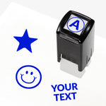 Customisable green self-inking 10mm stamper with the placeholder text 'YOUR TEXT' in bold green, alongside alternative options for icons such as smiling face or star, indicating space for a personalised image or message.