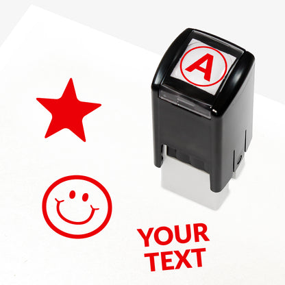 Customisable black self-inking 10mm stamper with the placeholder text 'YOUR TEXT' in bold black, alongside alternative options for icons such as smiling face or star, indicating space for a personalised image or message.