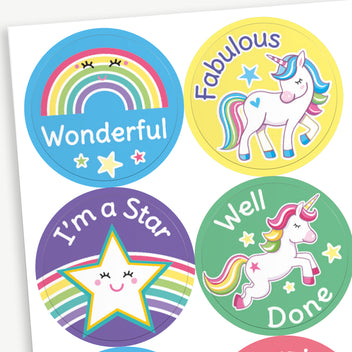 A selection of circular reward stickers for children with positive messages and cute designs showing a blue sticker with a rainbow and the word 'Wonderful', a yellow sticker with a unicorn and 'Fabulous', and a purple sticker with a smiling star and the phrase 'I'm a Star'. 