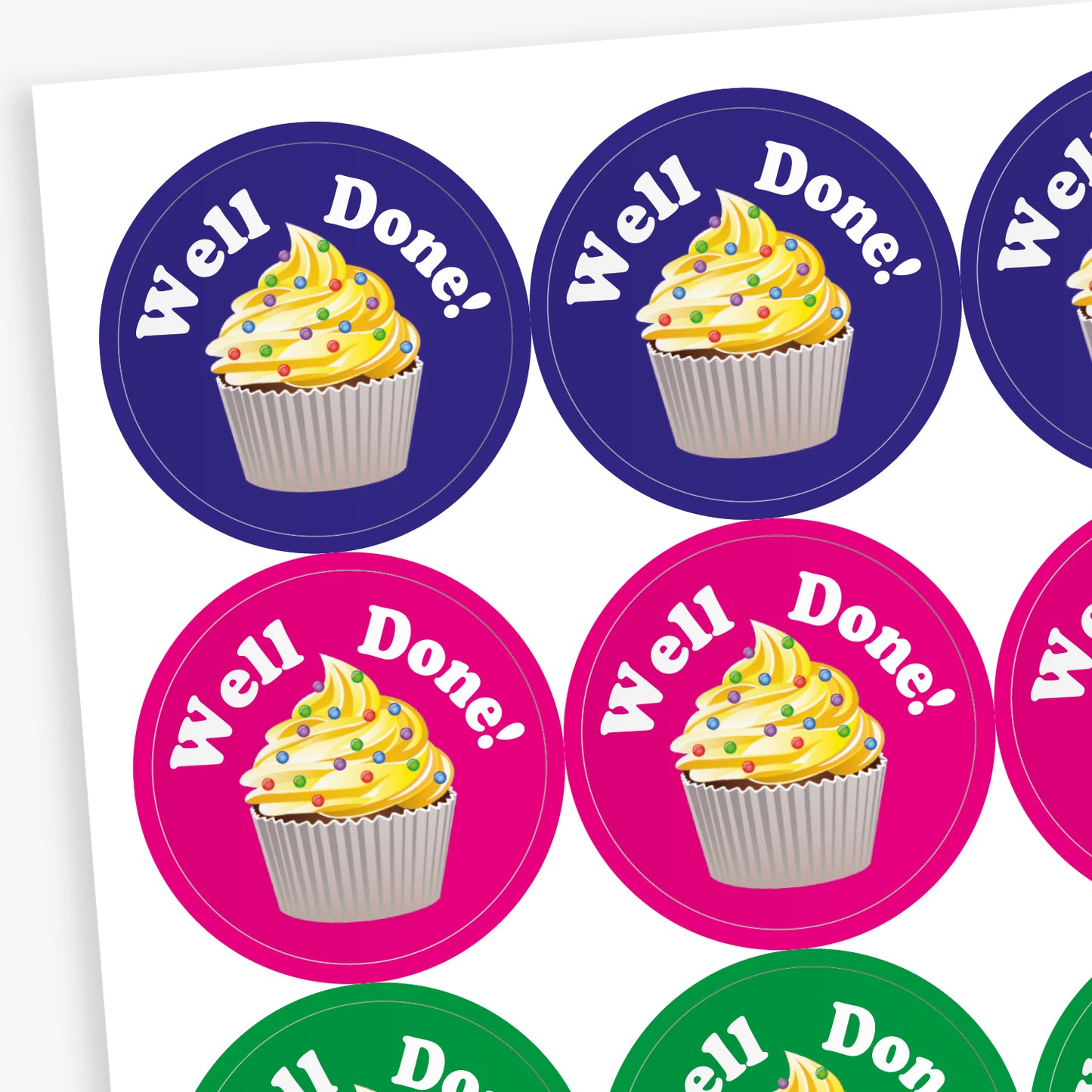 A sheet of circular, vanilla scented stickers, each with a cupcake with vanilla frosting as the main image below the phrase 'Well Done!'.  Colourful backgrounds of blue, magenta and green are shown.