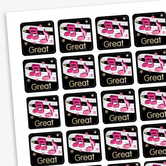 A sheet of 140 square 16mm reward stickers, each featuring the word 'Great' in bold gold text, set against a black background with a score of music and bold pink musical notes on it.