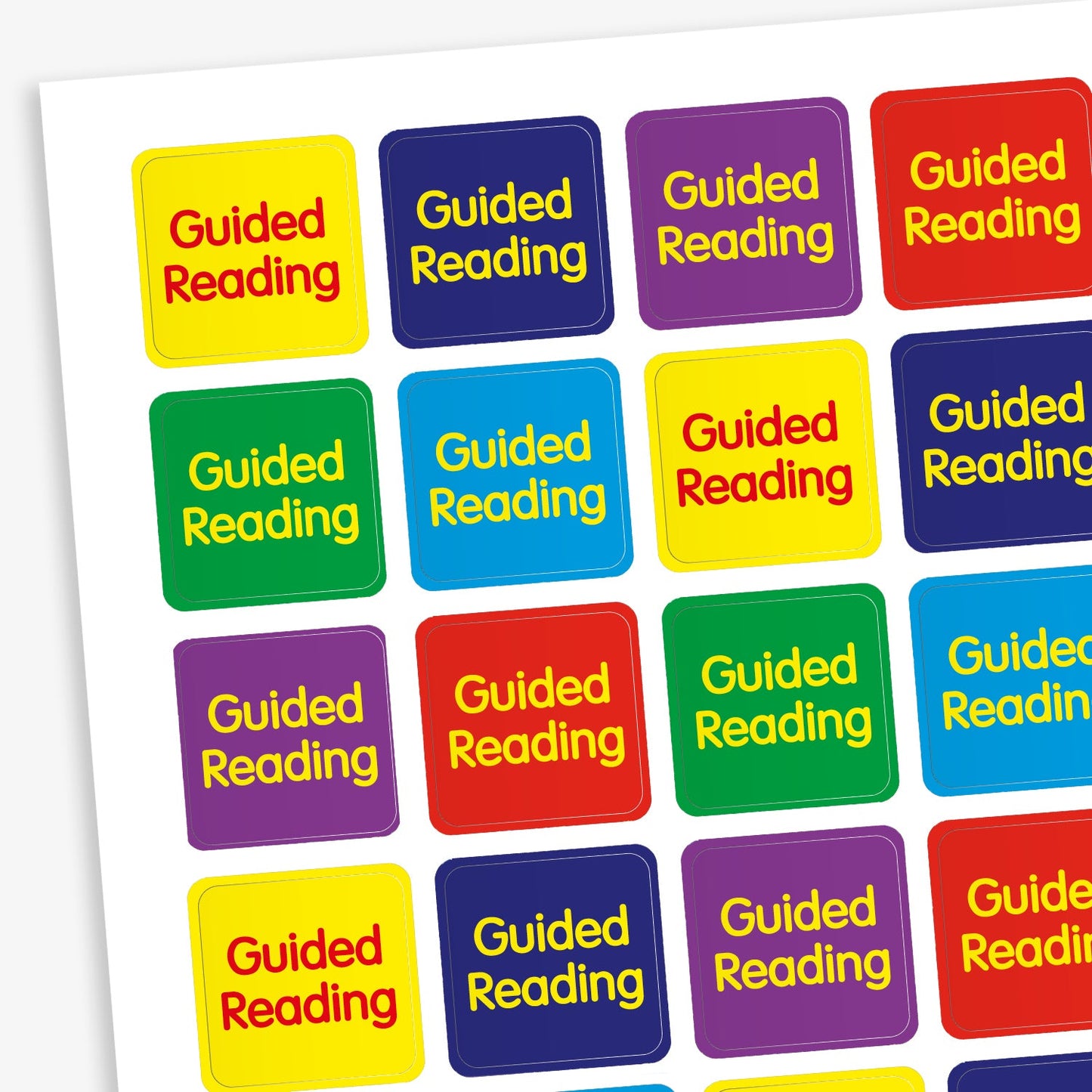 A sheet of 140 square 16mm reward stickers, each featuring the phrase 'Guided Reading' in bold yellow text, set against vibrant backgrounds of Red, Purple, Cyan, Dark Blue and Green.