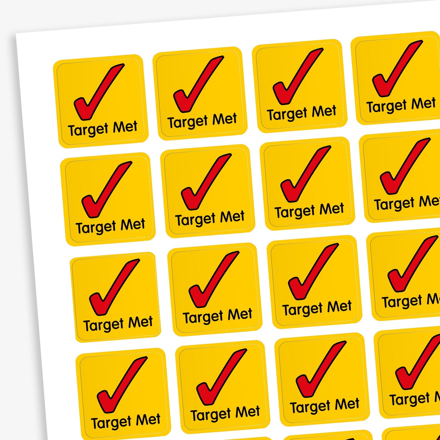 A sheet of 140 square 16mm reward stickers, each featuring the phrase 'Target Met' in black text below large red tick icon, set against a vibrant yellow background.