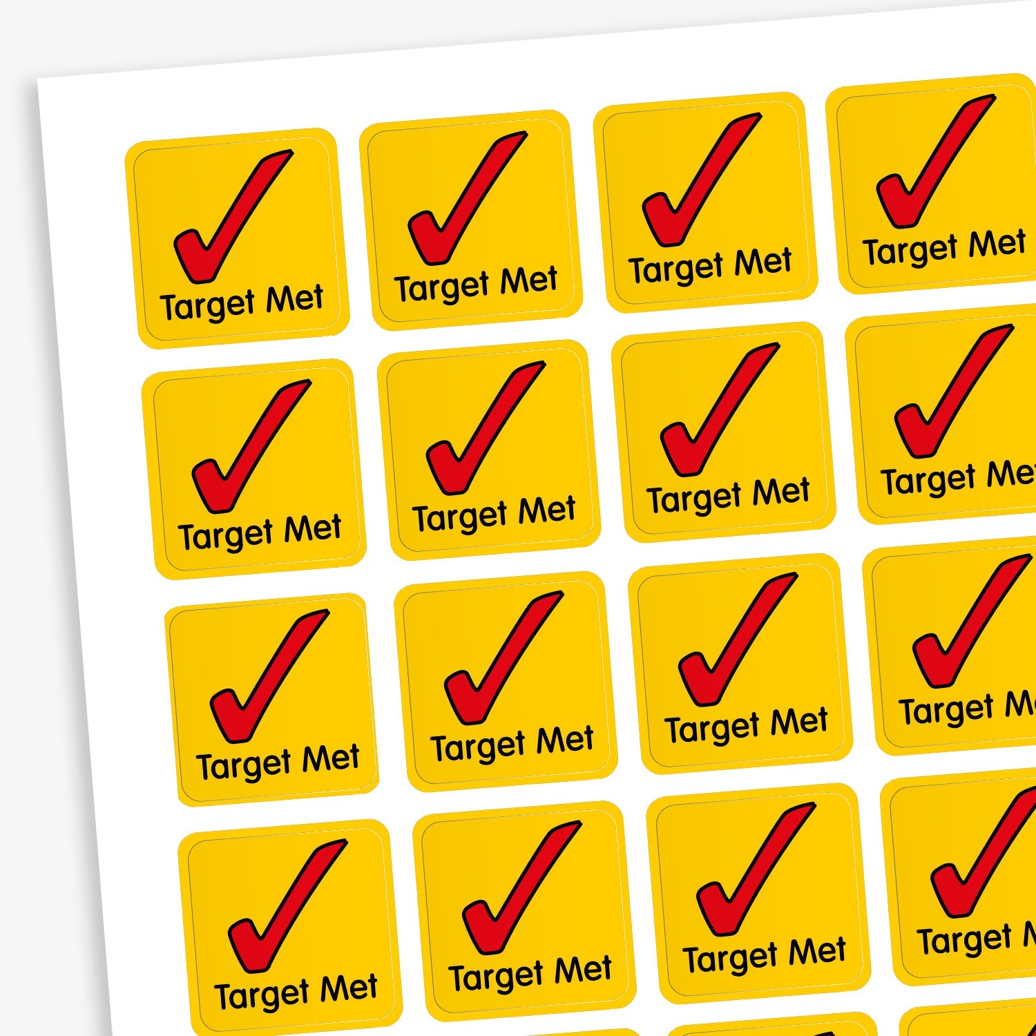 A sheet of 140 square 16mm reward stickers, each featuring the phrase 'Target Met' in black text below large red tick icon, set against a vibrant yellow background.