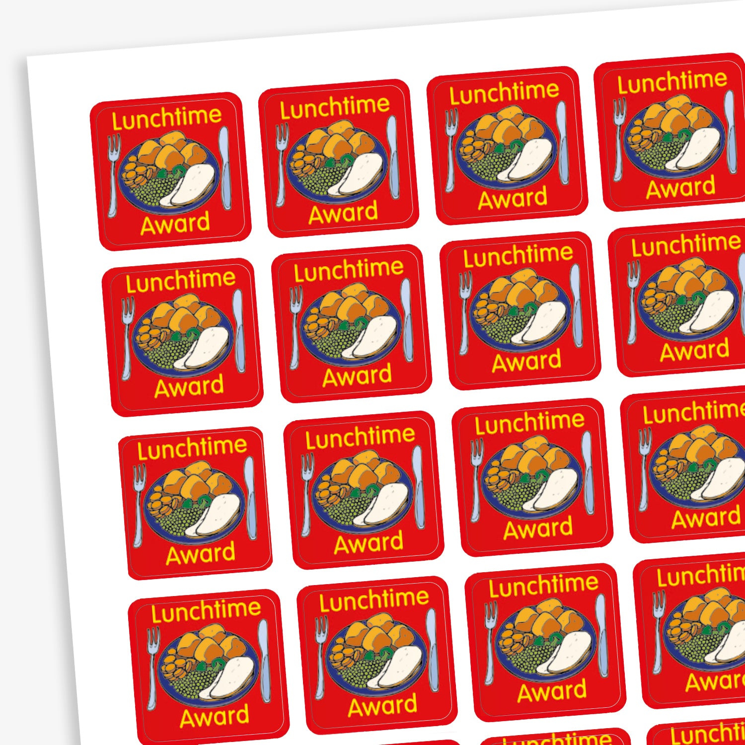 A sheet of square reward stickers with a red background, each featuring a colourful illustration of a dinner plate with vegetables, potatoes, and a drink. The text 'Lunchtime Award' is written in yellow above and below the image. Each sticker also includes a knife and fork graphic on either side of the plate. 