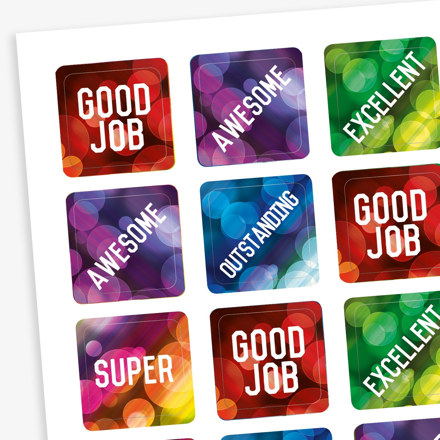 A sheet of square reward stickers with phrases including 'Good Job', 'Awesome', 'Excellent', 'Outstanding' and 'Super'.  The backgrounds are akin to lights through a rainy window and coloured red, purple, green and blue.