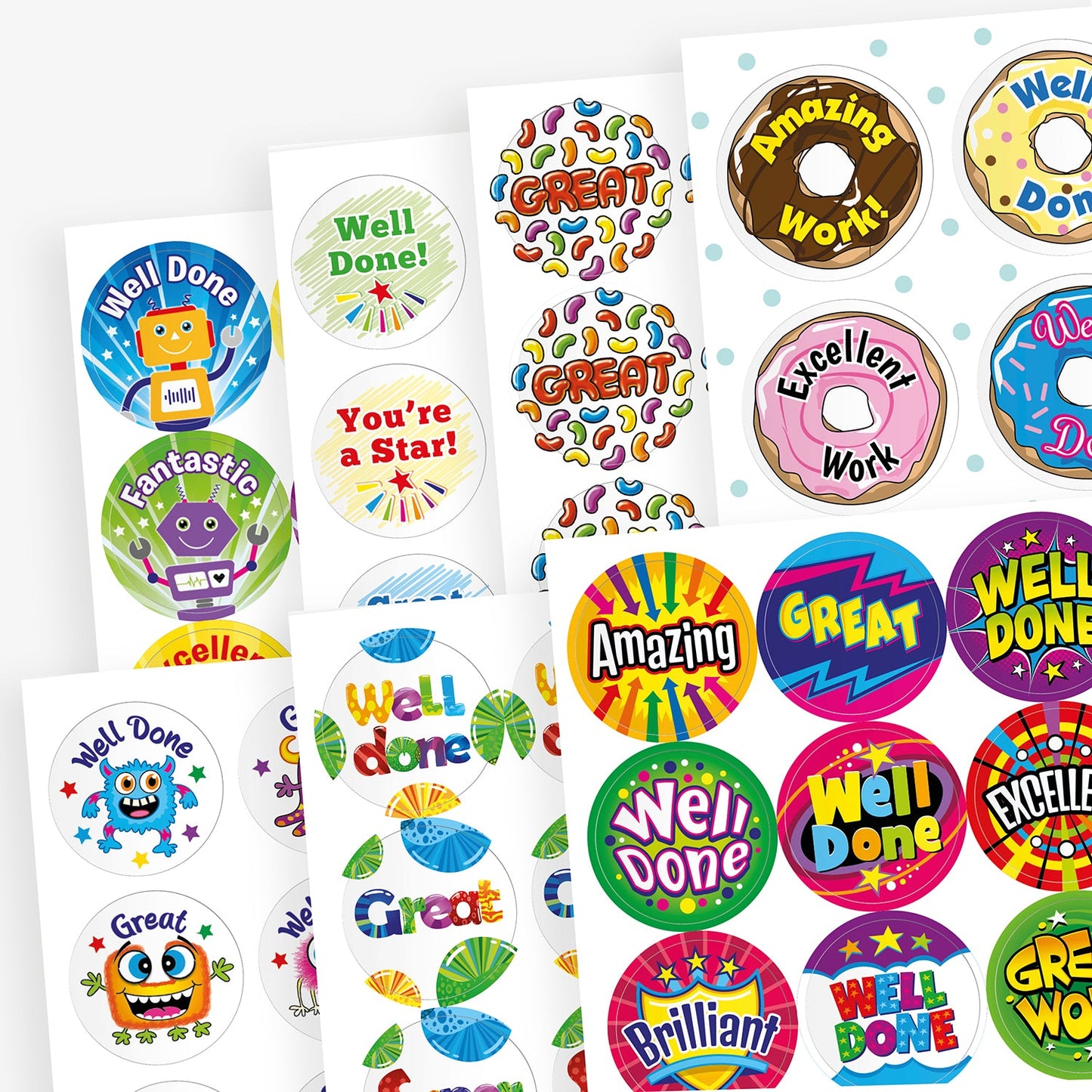 Assorted scented sheets of colourful reward stickers featuring positive messages such as 'Well Done', 'Great', 'Amazing Work', 'You're a Star!', and 'Excellent'. Designs include robots, donuts, stars, and vibrant patterns in various shapes and colours.