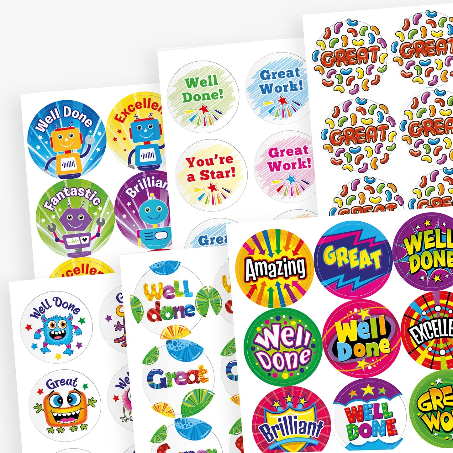 A scented variety pack of colourful reward sticker sheets featuring different designs and messages. Phrases include 'Well Done!', 'Great Work!', 'You're a Star!', 'Fantastic', 'Amazing', 'Brilliant', and 'Excellent'. Designs include cartoon robots, stars, colourful leaves, bold comic-style text, and cheerful characters. Each sheet has a unique theme and layout to celebrate pupil achievements.