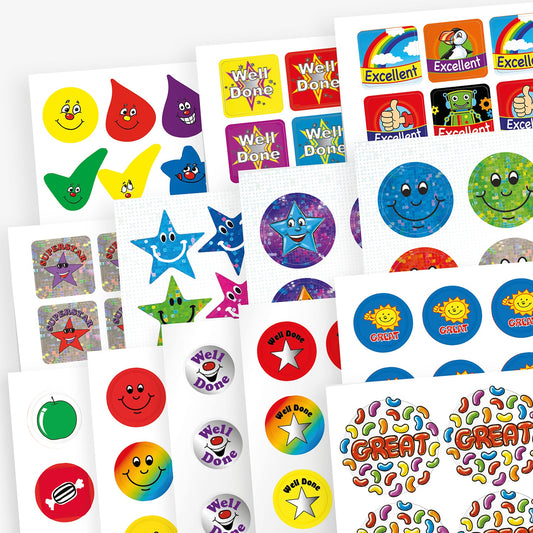 Variety pack of colourful reward stickers featuring cheerful designs such as smiley faces, stars, droplets, cartoon suns, and phrases like 'Well Done', 'Excellent', and 'Great', displayed on multiple sticker sheets.