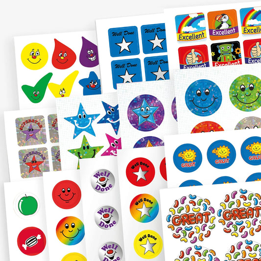 Variety pack of colourful reward stickers featuring cheerful designs such as smiley faces, stars, droplets, cartoon suns, and phrases like 'Well Done', 'Excellent', and 'Great', displayed on multiple sticker sheets.
