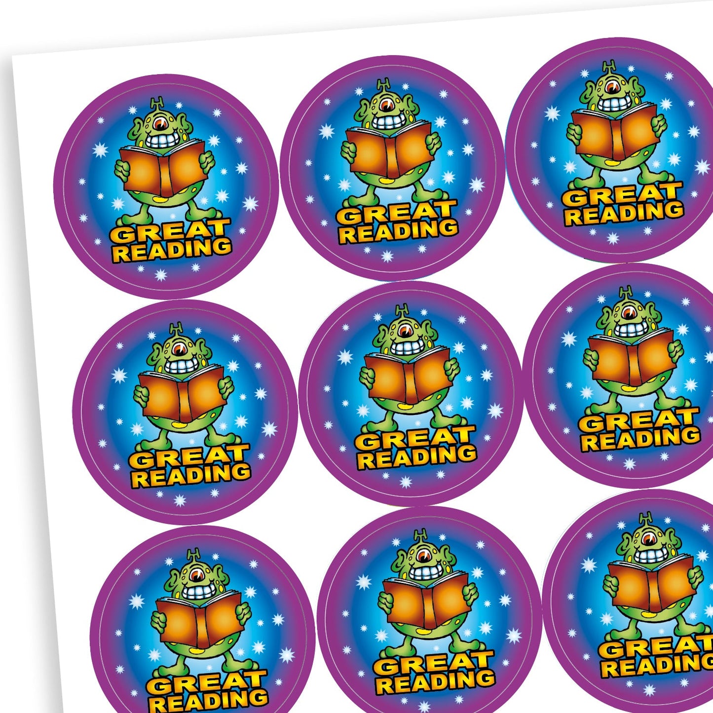 A sheet of round reward stickers featuring a cartoon monster holding an open book with a joyful expression. Each sticker has a blue centre with stars, a purple border, and the text 'GREAT READING' in bold yellow letters below the monster.