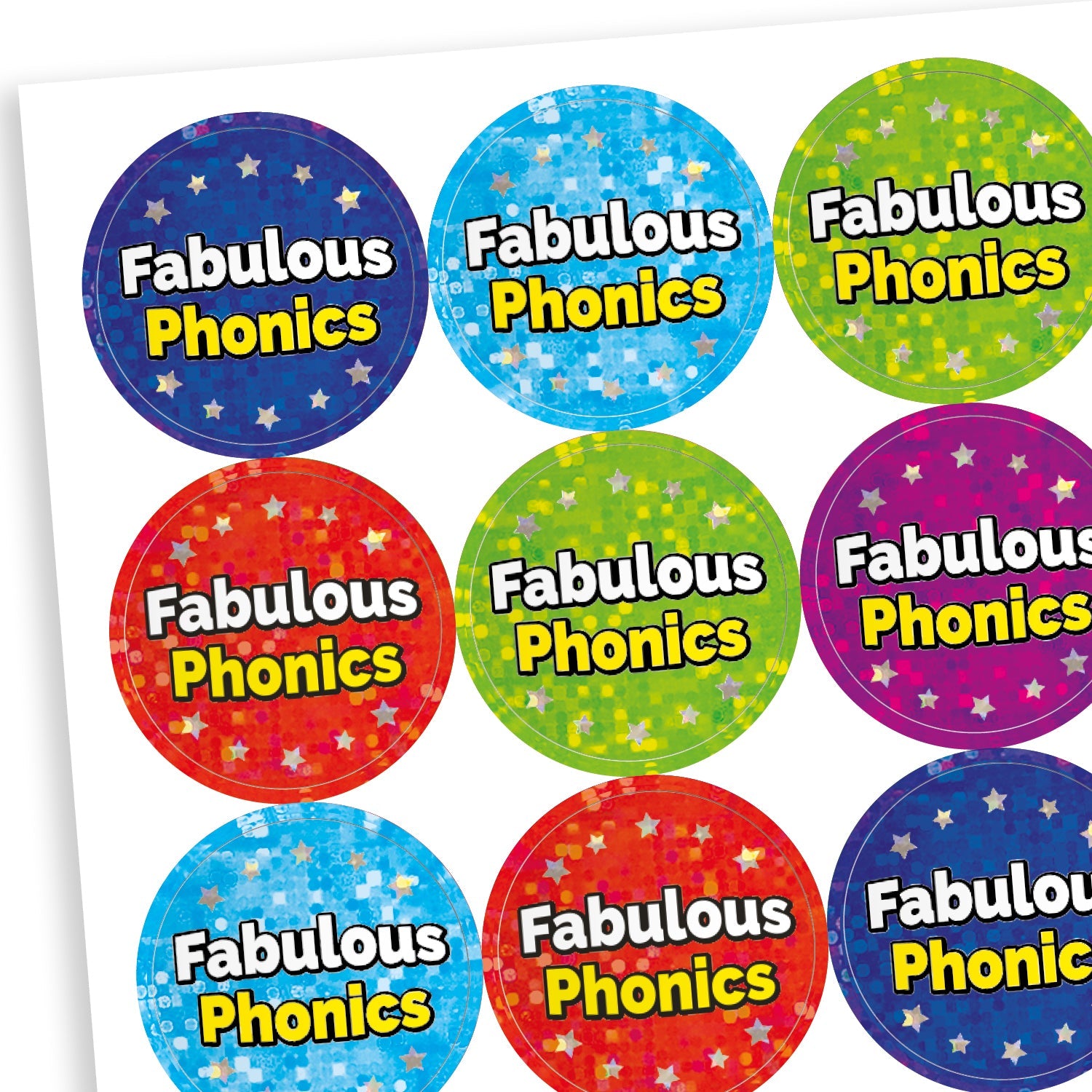 A sheet of round holographic reward stickers with the phrase 'Fabulous Phonics' in bold white and yellow text. The stickers have starry backgrounds in various bright colours including blue, red, green, purple, and turquoise, creating a cheerful and encouraging appearance.