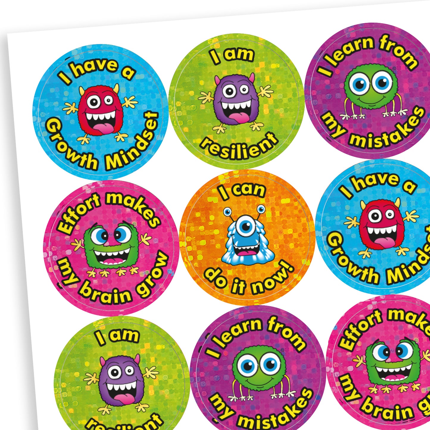 A sheet of shiny, holographic circular stickers featuring colourful cartoon monsters and growth mindset messages. The stickers include phrases such as: 'I have a Growth Mindset', 'I am resilient', 'I learn from my mistakes', 'Effort makes my brain grow', and 'I can do it now!'. Each sticker has a glittery background in vibrant colours like blue, green, pink, orange, and purple.