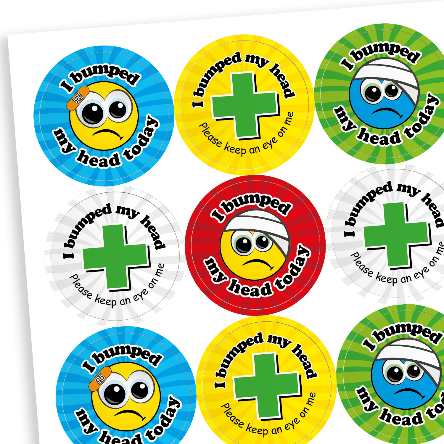 Sheet of vibrant coloured circular stickers with two main designs.  A cartoon face with a plaster or bandage on the head has text surrounding the image saying 'I bumped my head today!'; the seconf is a central first aid cross with the words 'I bumped my head today.  Please keep an eye on me' sorrounding it