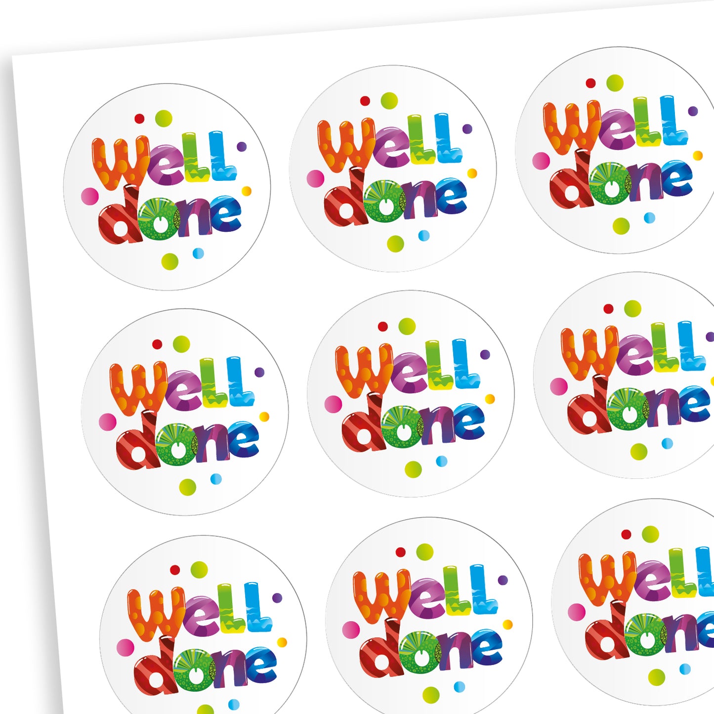 A sheet of white circluar stickers with the phrase 'Well done' in mulitcolours in the centre with dots of colour surrounding the text.
