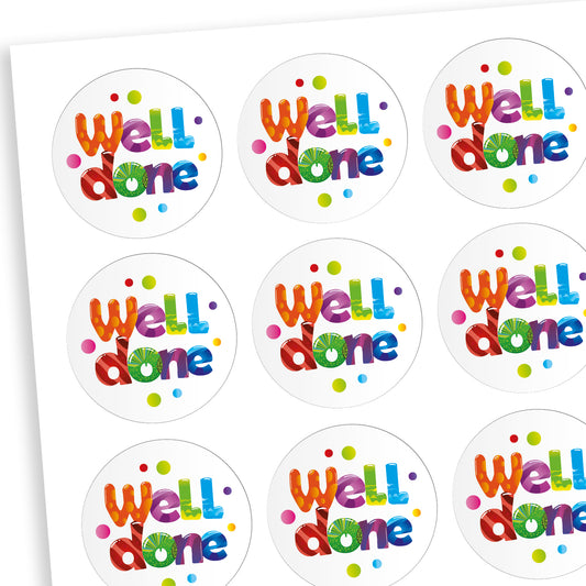 A sheet of white circluar stickers with the phrase 'Well done' in mulitcolours in the centre with dots of colour surrounding the text.
