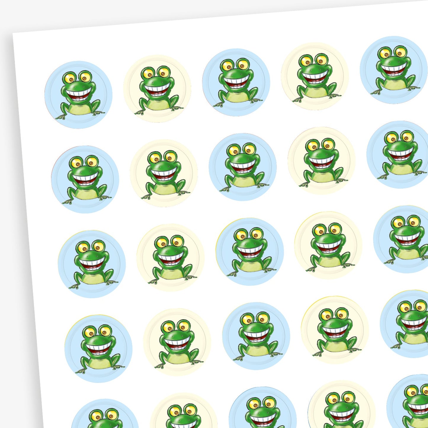 Sheet of 196 assorted 10mm circular reward stickers featuring a smiling cartoon frog, on a background of either light blue or cream. Each sticker is designed to motivate and reward pupils, suitable for use on charts, books, and clothing.