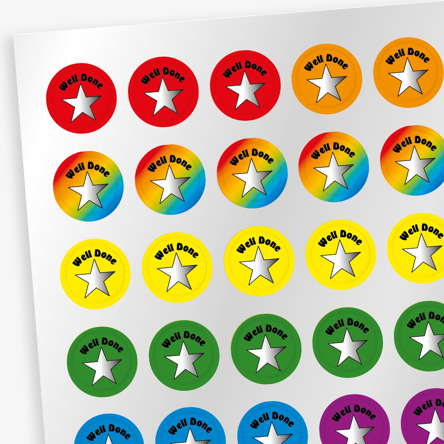 4 Sheets of 196 metallic 10mm circular reward stickers featuring a silver star on colourful backgrounds such as red, orange, rainbow, yellow, green, blue or purple with the phrase 'Well Done' above the star. Each sticker is designed to motivate and reward pupils, suitable for use on charts, books, and clothing.