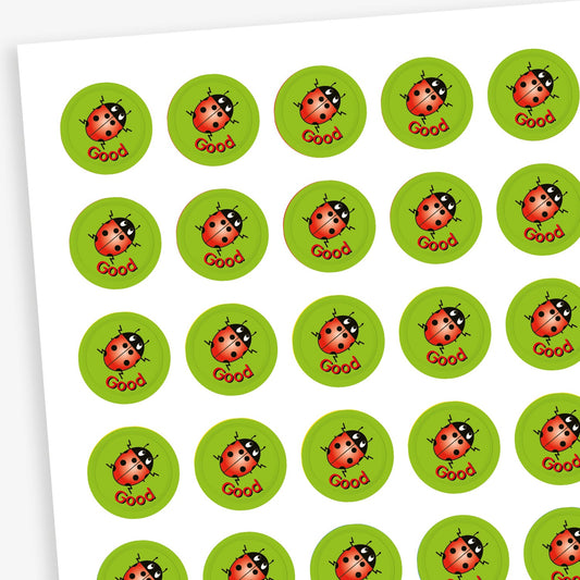 Sheet of 196 assorted 10mm circular reward stickers featuring ladybird on a green background, each sticker has the word 'Good' underneath the ladybird. Each sticker is designed to motivate and reward pupils, suitable for use on charts, books, and clothing.