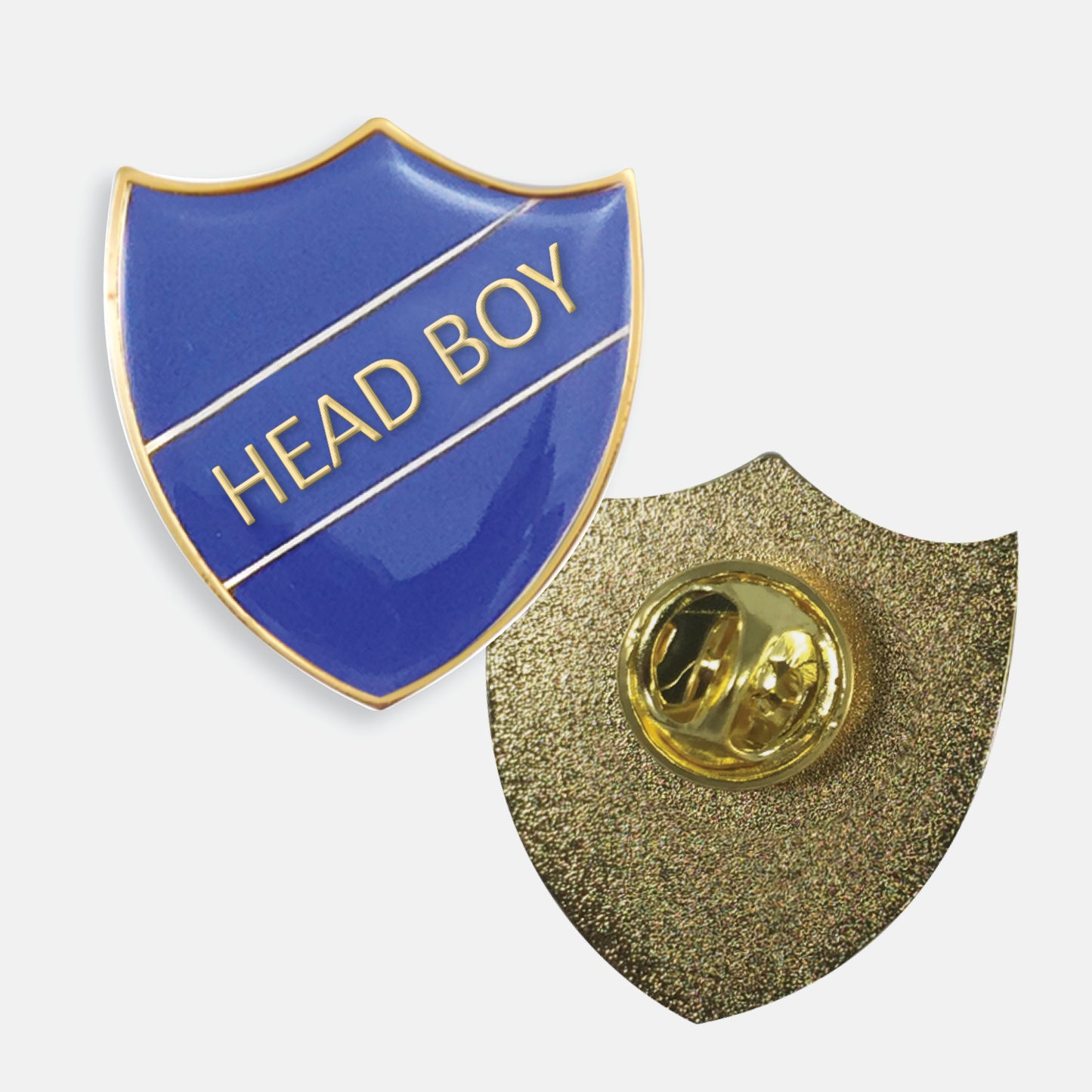 Blue enamel badge in the shape of a shield with gold trim and diagonal gold line either side of the words 'HEAD BOY' in capital letters. The reverse side shows a textured gold back with a pin fastening