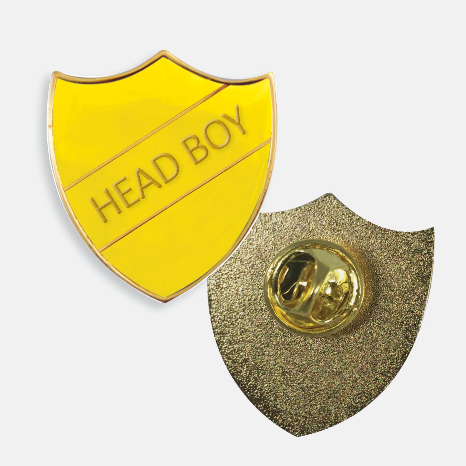 Yellow enamel badge in the shape of a shield with gold trim and diagonal gold line either side of the words 'HEAD BOY' in capital letters. The reverse side shows a textured gold back with a pin fastening
