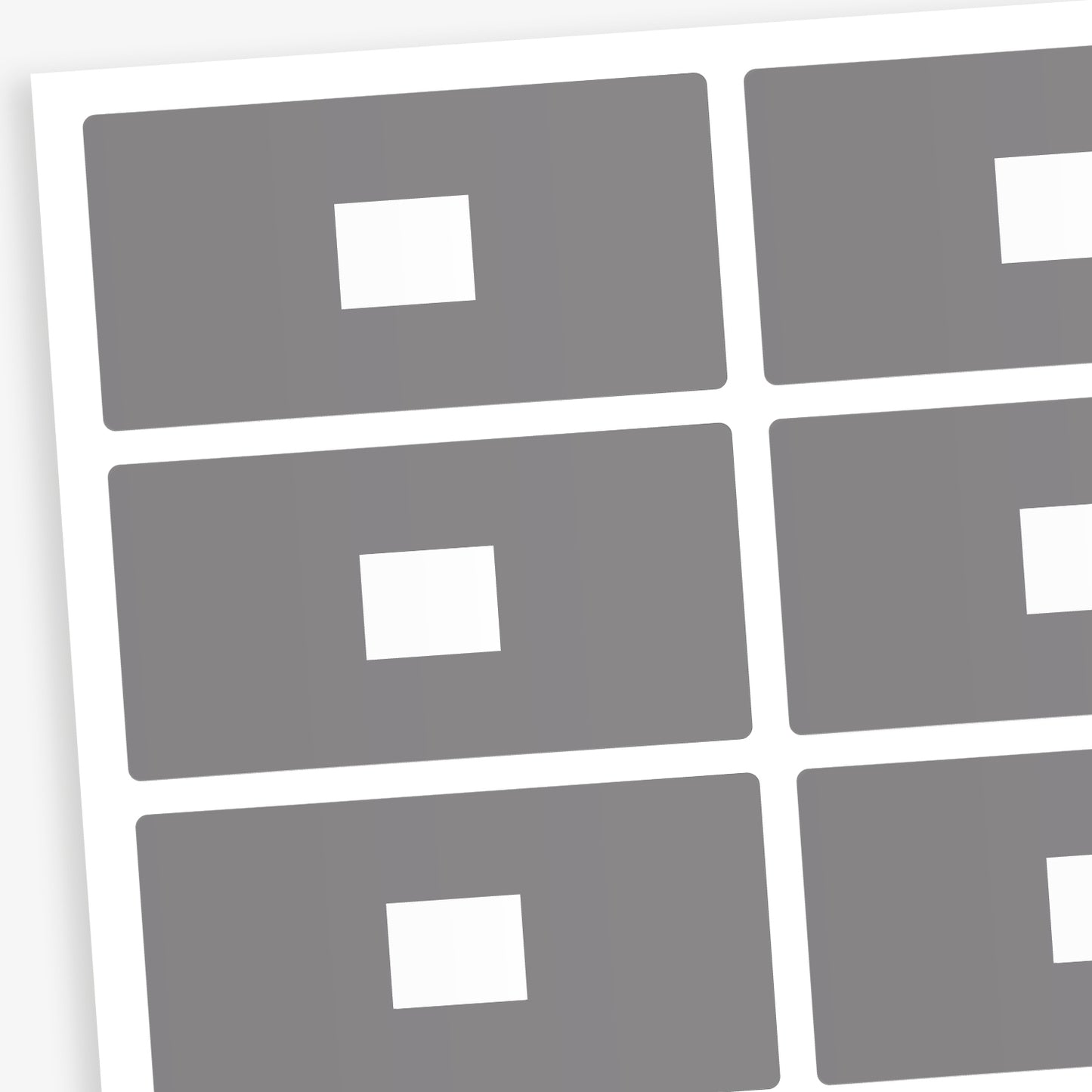 A set of 100 rectangular library labels, each measuring 72mm by 38mm, featuring a grey background with a white central panel for handwritten or printed text; designed to assist in categorising and organising books within educational settings