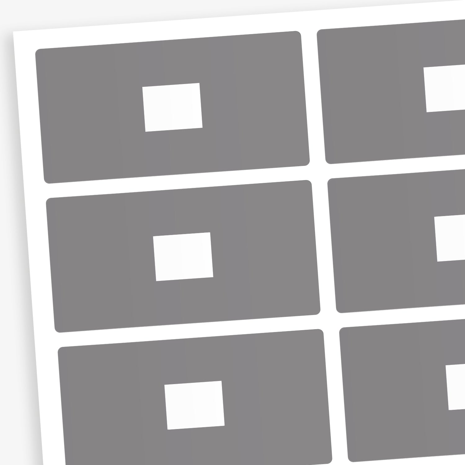 A set of 100 rectangular library labels, each measuring 72mm by 38mm, featuring a grey background with a white central panel for handwritten or printed text; designed to assist in categorising and organising books within educational settings