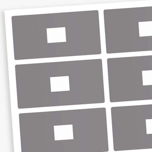 A set of 100 rectangular library labels, each measuring 72mm by 38mm, featuring a grey background with a white central panel for handwritten or printed text; designed to assist in categorising and organising books within educational settings