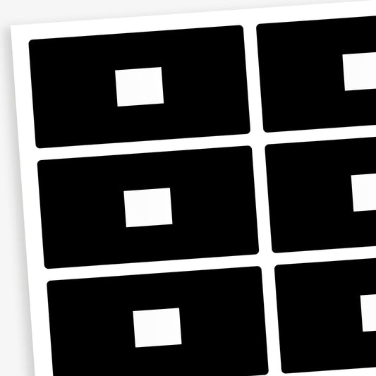 A set of 100 rectangular library labels, each measuring 72mm by 38mm, featuring a black background with a white central panel for handwritten or printed text; designed to assist in categorising and organising books within educational settings