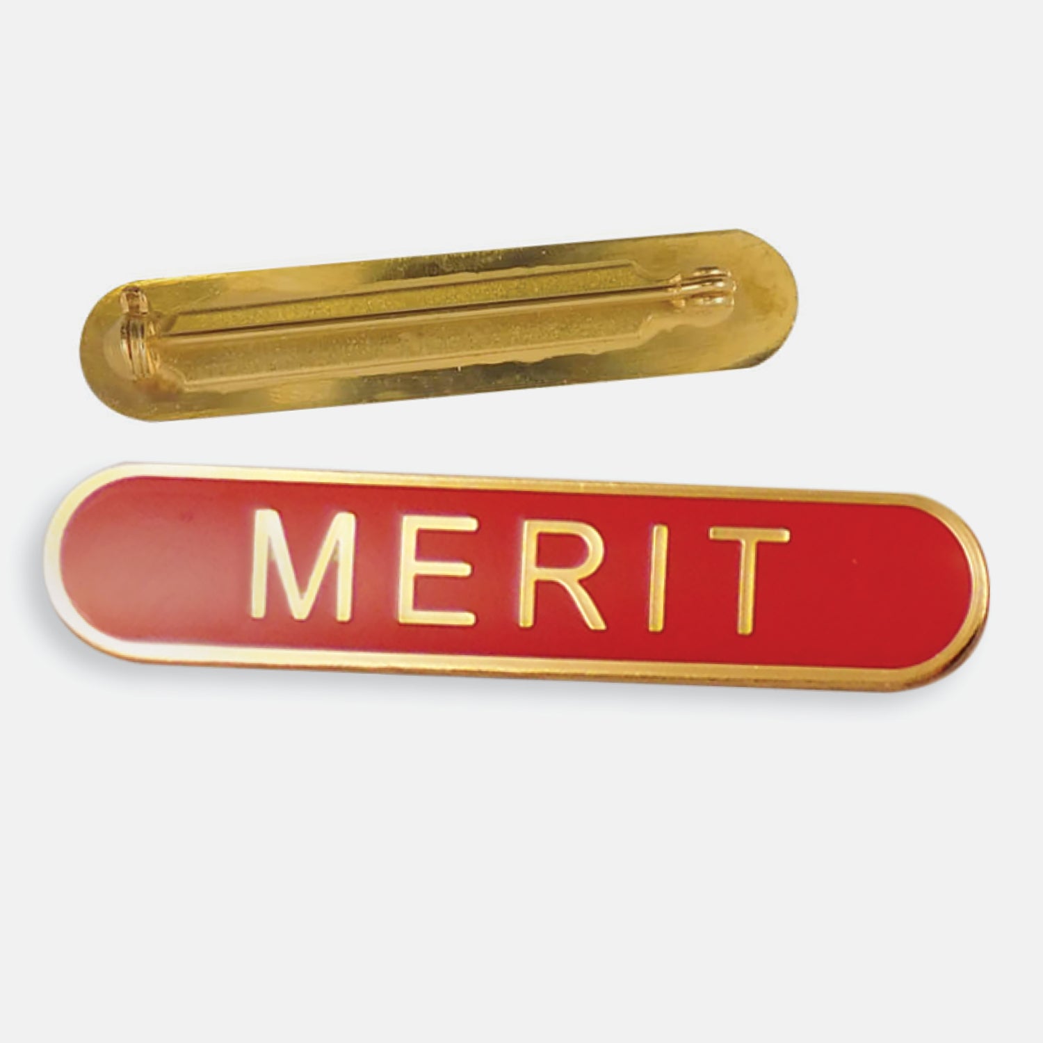 Red enamel badge in a long oval shape with a gold trim and the word 'MERIT' central in gold capital letters. The reverse side shows a gold back with a pin fastening