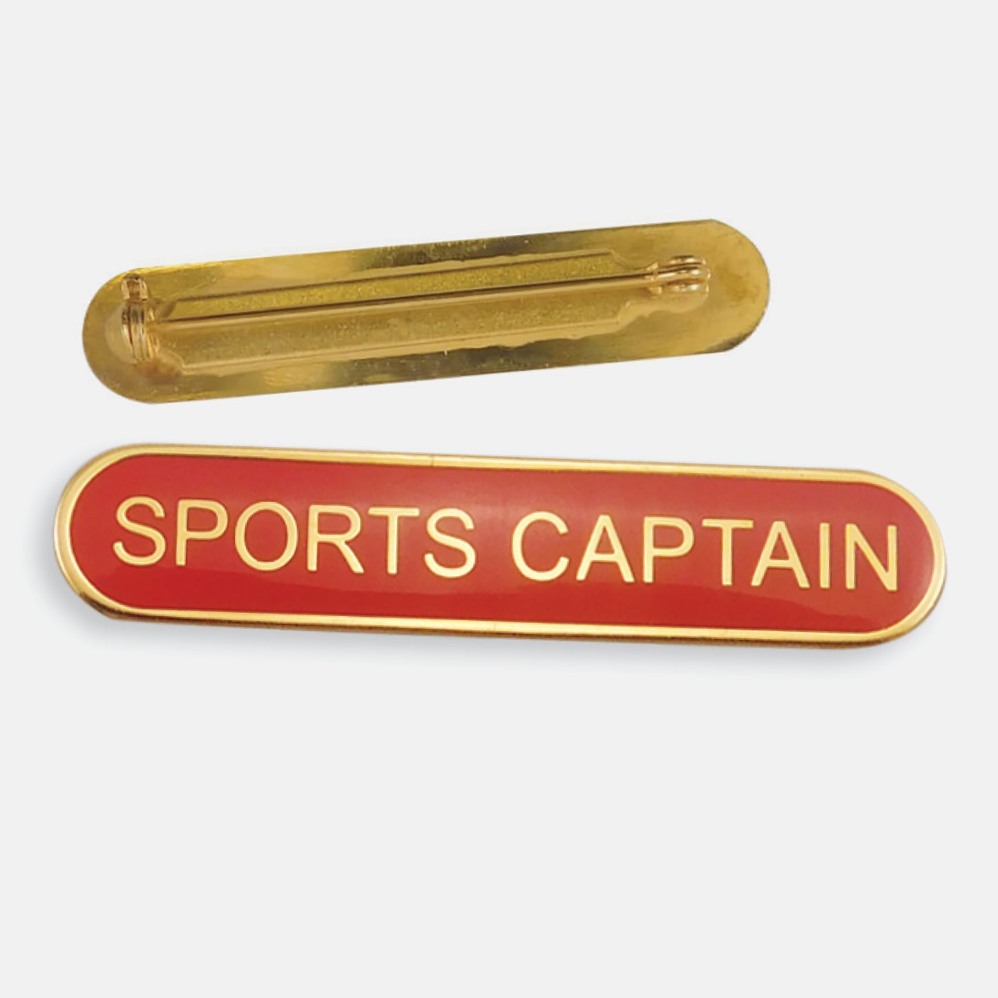 Red enamel badge in a long oval shape with a gold trim and the words 'SPORTS CAPTAIN' central in gold capital letters. The reverse side shows a gold back with a pin fastening