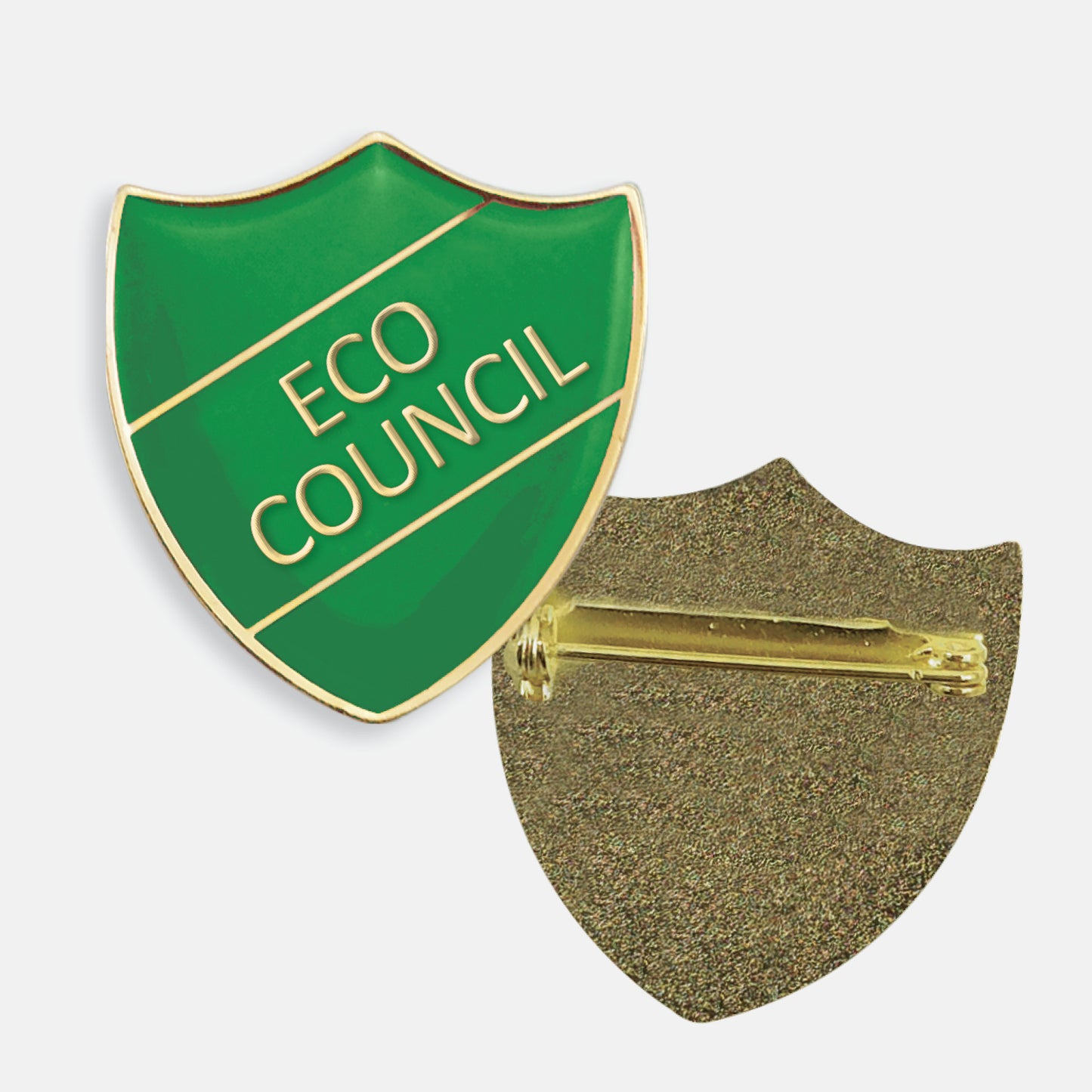 Green enamel badge in the shape of a shield with gold trim and diagonal gold line either side of the wording 'ECO COUNCIL' in capital letters. The reverse side shows a textured gold back with a pin fastening