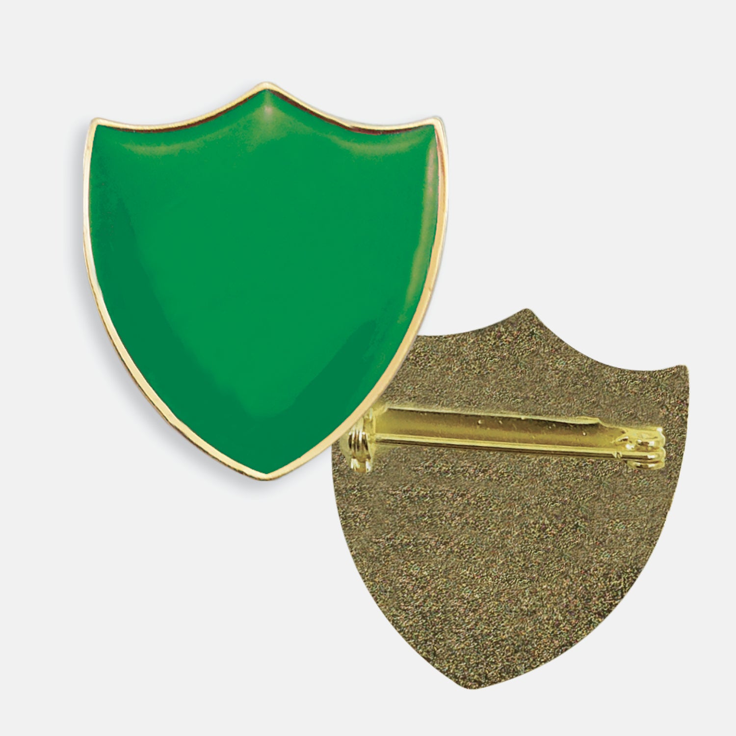 Green enamel badge in the shape of a shield with gold trim. The reverse side shows a textured gold back with a pin fastening