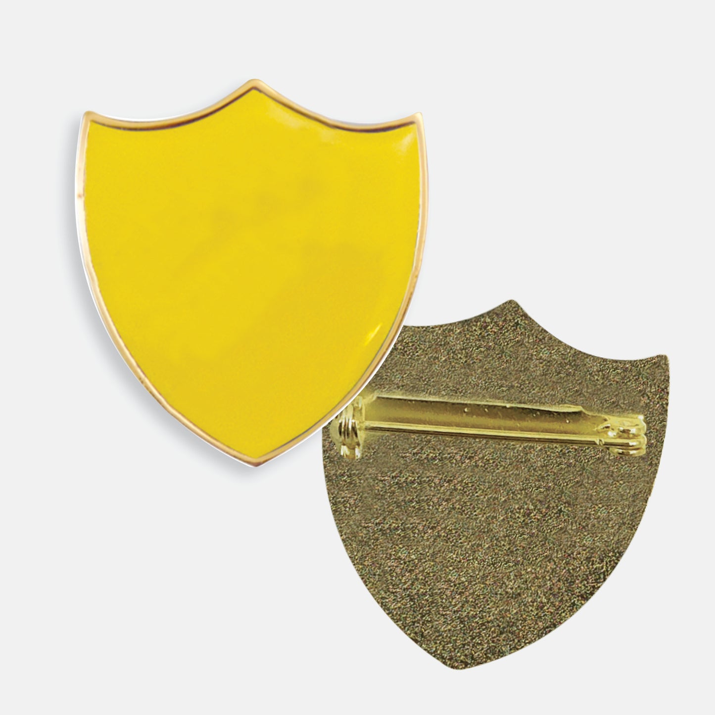 Yellow enamel badge in the shape of a shield with gold trim. The reverse side shows a textured gold back with a pin fastening