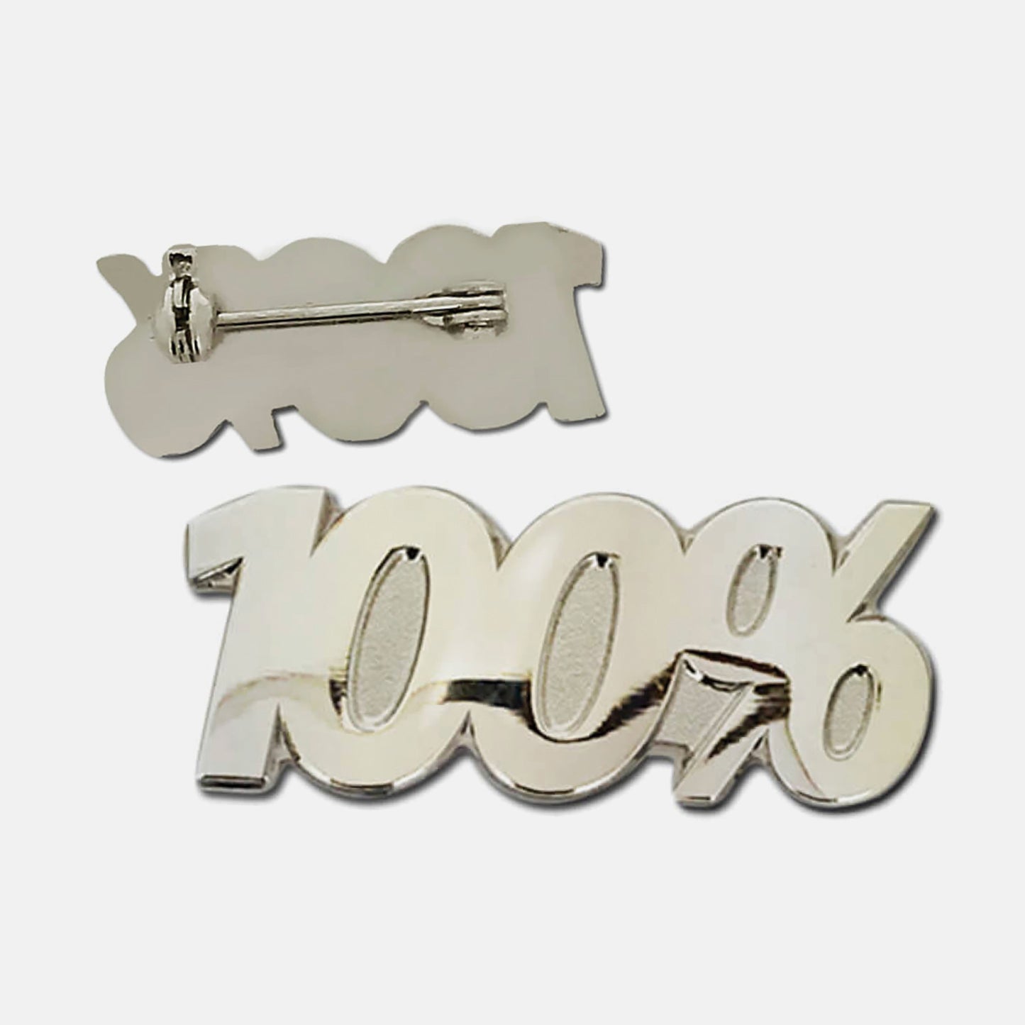 Silver-coloured pin badge in the shape of the text '100%', with one badge showing the front and another showing the back with a pin fastening.