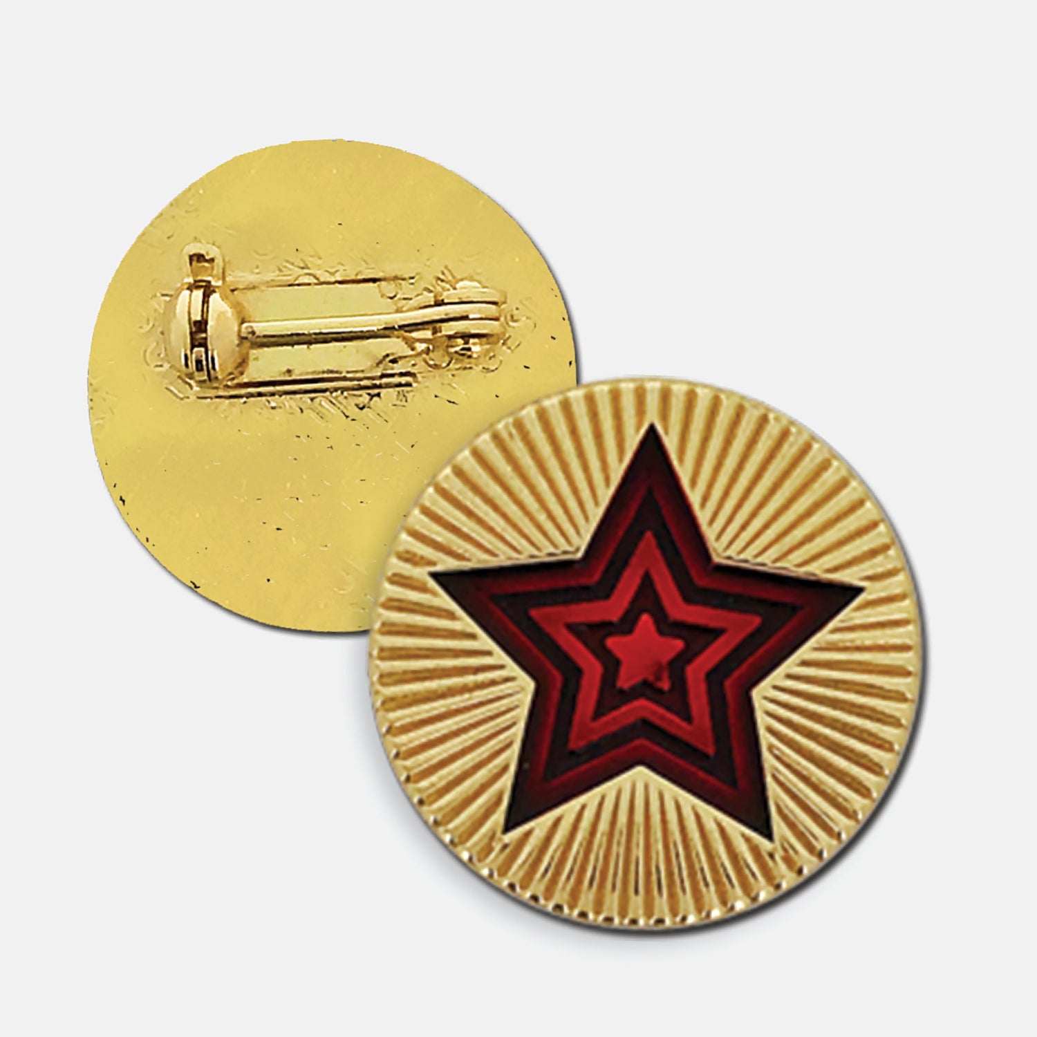 Gold enamel round badge with a radiating red star in the centre, the gold enamel surrounding the star is engraved to depict a starburst. The reverse side shows a gold back with a pin fastening.