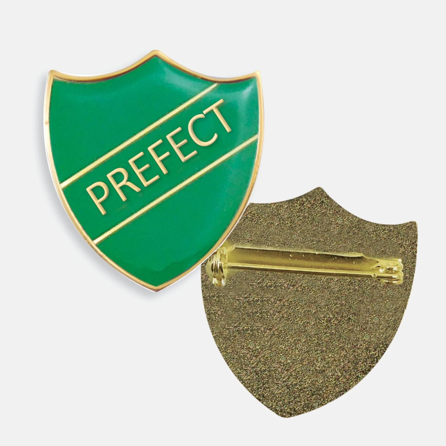 Green enamel prefect badge in the shape of a shield with gold trim and diagonal gold line either side of the word 'PREFECT' in capital letters. The reverse side shows a textured gold back with a pin fastening.
