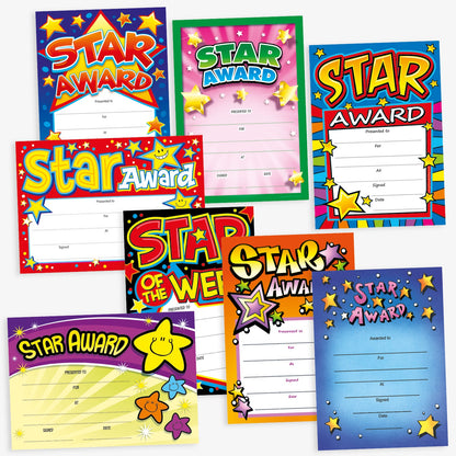 Assortment of A5 Star Award certificates in various vibrant designs, each featuring the bold title 'Star Award'. The certificates display colourful backgrounds with star motifs and include spaces for 'Presented to', 'For', 'At', 'Signed', and 'Date' entries, designed to celebrate and acknowledge pupil achievements.