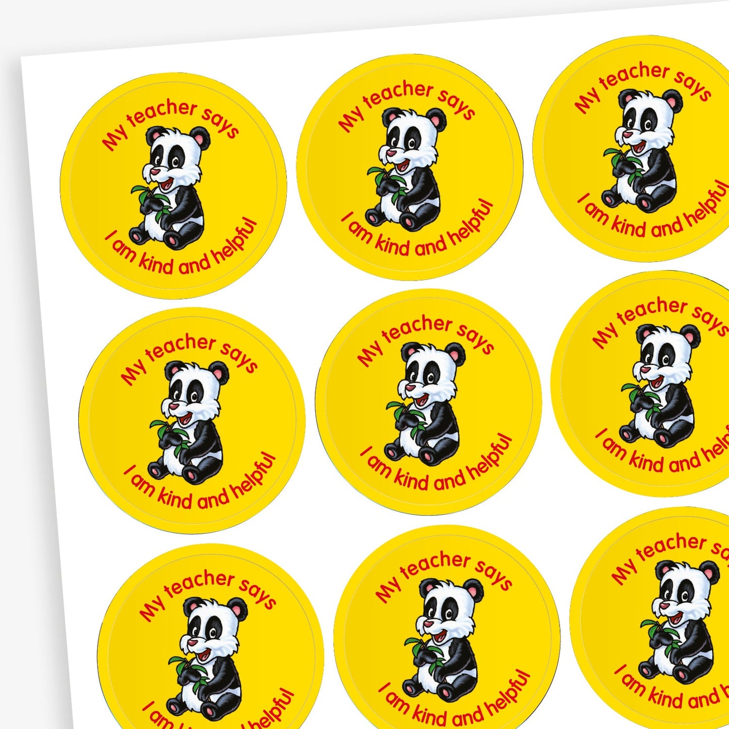 A sheet of circular reward stickers featuring a yellow background with a cuddly panda eating bamboo in the centre. Each sticker includes the text 'My teacher says' curved along the top of the sticker and 'I am kind and helpful' along the  bottom edge.