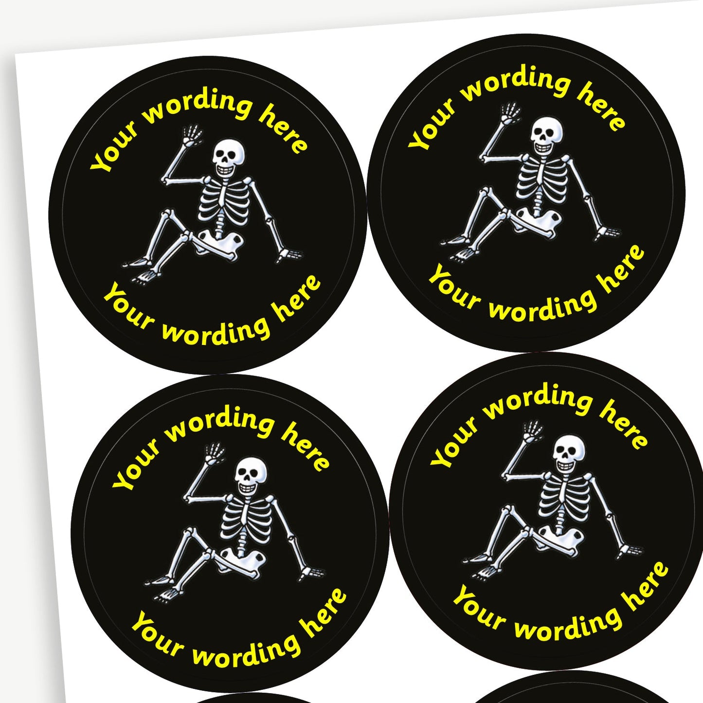 A sheet of black stickers featuring a white skeleton sat down in the centre.  Placeholder text 'Your wording here' is above and below the image for customisation.